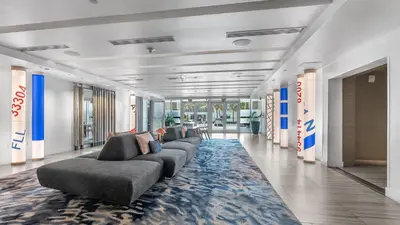 a living room with couches and a rug at Your Private Oceanfront Sanctuary 2BR 2BA in Fort Lauderdale