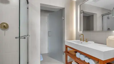 a bathroom with a sink and a shower at Your Private Oceanfront Sanctuary 2BR 2BA in Fort Lauderdale