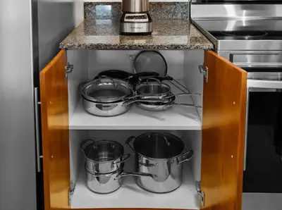 a bunch of pots and pans on a shelf in a kitchen at Luxury Brickell Waterfront View - Amazing Furnished Balcony - Walk-Water-WiFi in Miami