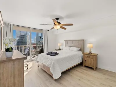 a bedroom with a bed and a ceiling fan at Luxury Brickell Waterfront View - Amazing Furnished Balcony - Walk-Water-WiFi in Miami