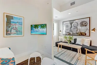 a living room with a couch and a table at Artease 2 -Largest, stylish, Peloton bike, near Wynwood Walls & restaurants in Miami