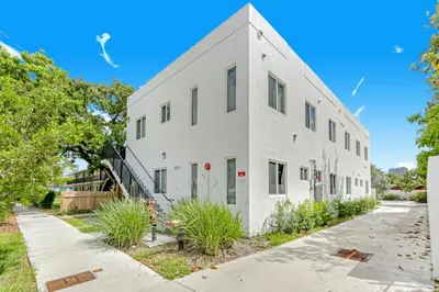 an exterior view of a white building with plants at ArTease3 - stylish, near Wynwood Walls & restaurants in Miami