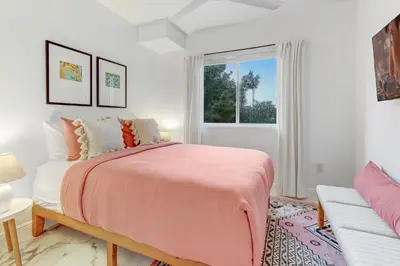 a bedroom with a large bed and a window at ArTease5 - stylish, near Wynwood Walls & restaurants in Miami