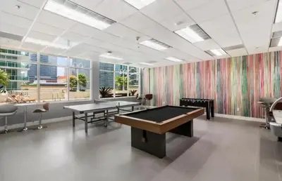 a gaming room with two tables and a pool table at Modern 1 Bed in the Heart of Brickell With Free Parking in Miami