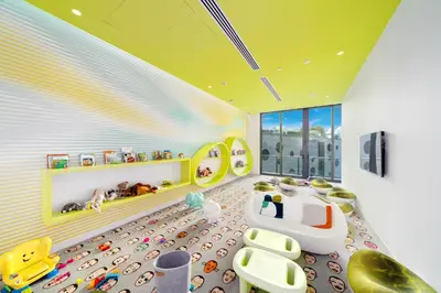 a childs room with a playroom with a yellow ceiling at Exclusive High-Rise Edgewater 1BD - Tennis & Sauna in Miami