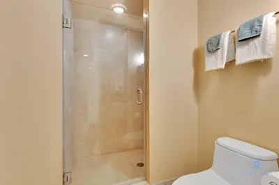 a bathroom with a shower and a toilet at Luxurious Beach Resort Balcony in Sunny Isles Beach