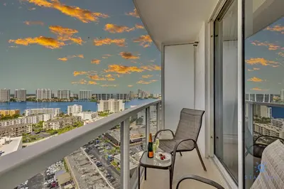 a balcony with a view of a city at Luxurious Beach Resort Balcony in Sunny Isles Beach