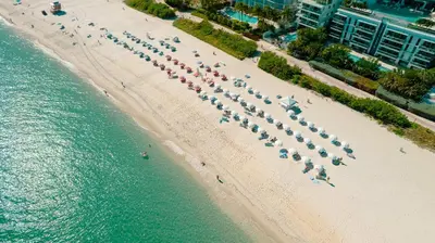 an overhead view of a beach with a group of people at Ocean 2 Sky at Monte Carlo Miami Beach in Miami Beach