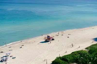 an overhead view of a beach with people on it at Ocean 2 Sky at Monte Carlo Miami Beach in Miami Beach
