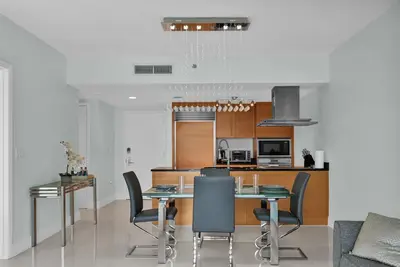 a kitchen and dining room with a table and chairs at Perfect One Bedroom at Icon Brickell Amazing views in Miami