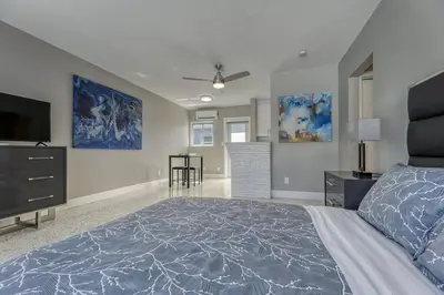 a bedroom with a bed and a flat screen tv at Sunshine Manor 2017-2 in Fort Lauderdale