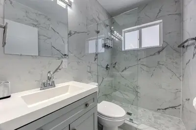 a bathroom with a sink and a toilet and a shower at Sunshine Manors 2013 A in Fort Lauderdale