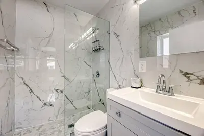 a bathroom with a toilet and a sink and a shower at Sunshine Manor 2017-1 in Fort Lauderdale