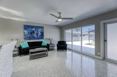 a living room with a couch and a ceiling fan at Sunshine Manor 2017-1 in Fort Lauderdale