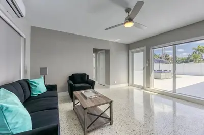 a living room with a couch and a table at Sunshine Manors 2017-3 in Fort Lauderdale