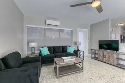 a living room with a couch and a tv at Sunshine Manors 2025-A in Fort Lauderdale