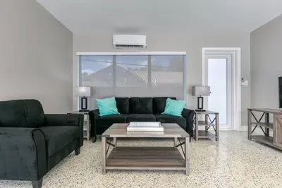 a living room with a couch and a coffee table at Sunshine Manors 2025-A in Fort Lauderdale