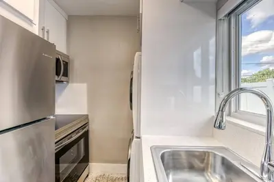 a small kitchen with a sink and a window at Sunshine Manors 2025-B in Fort Lauderdale
