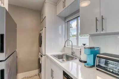 a kitchen with a sink and a microwave at Sunshine Manors 2025-B in Fort Lauderdale