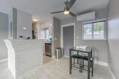 a kitchen with a counter and a table in a room at Sunshine Manors 2025-B in Fort Lauderdale