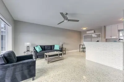 a living room with a couch and a table at Sunshine Manor 2025-C in Fort Lauderdale
