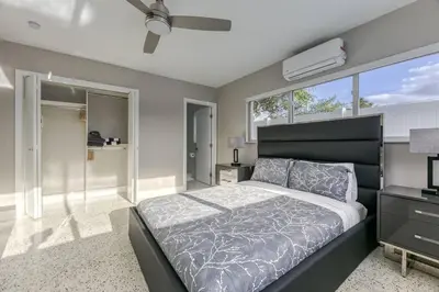 a bedroom with a bed and a large window at Sunshine Manor 2025-C in Fort Lauderdale