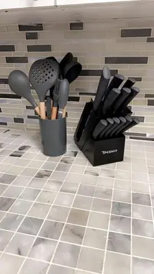 two containers of utensils sitting on a kitchen counter at BOOK ME, 3mins Hard Rock Stadium in Miami Gardens