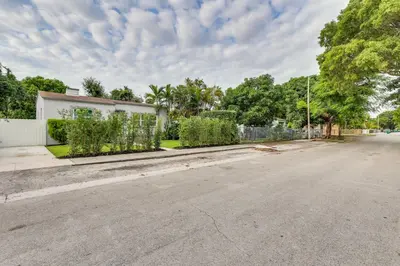 an empty street in front of a house at Stylish Miami Home 2 Mi to Intracoastal Waterway! in Miami