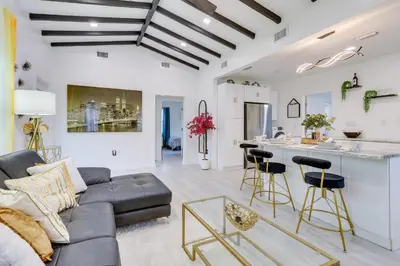 a living room with a couch and a table at Stylish Miami Home 2 Mi to Intracoastal Waterway! in Miami