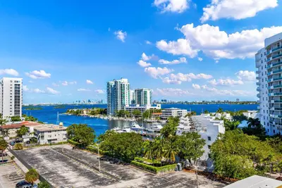 a view of a city with a river and buildings at Waterfront Studio Condo in the Heart of Miami - Skyline & Bay Views in Miami Beach