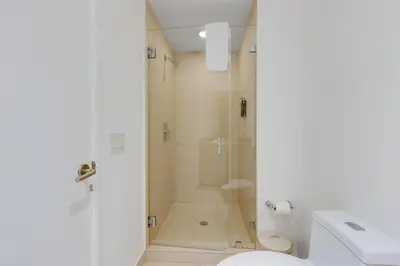 a bathroom with a shower and a toilet at 18th Floor Ocean Views Pool Beach Fitness in Hallandale Beach