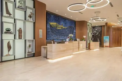 a lobby of a store with a large painting on the wall at 18th Floor Ocean Views Pool Beach Fitness in Hallandale Beach