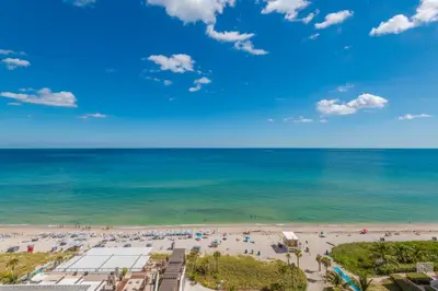 an aerial view of the beach and the ocean at 18th Floor Ocean Views Pool Beach Fitness in Hallandale Beach