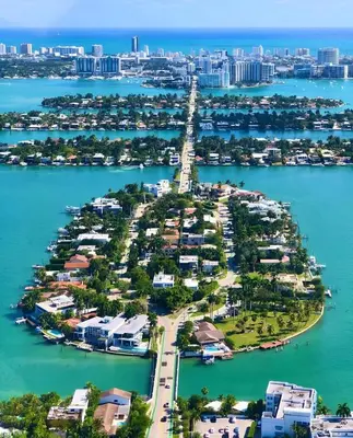 an island in the water with a city at Huge 1 bed newly renovated free parking in Miami
