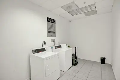 a white room with two washing machines in it at Ocean Reserve Condominium in Miami Beach