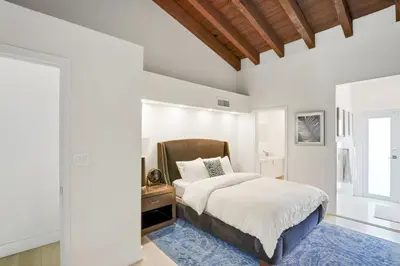 a white bedroom with a bed and a window at Luxury Pool Villa at St. James UNIT E, Pet Friendly in Miami