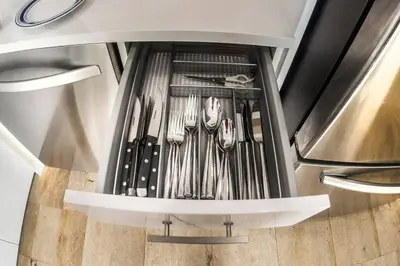 a kitchen with utensils in an appliance at Luxury Pool Villa at St. James UNIT E, Pet Friendly in Miami