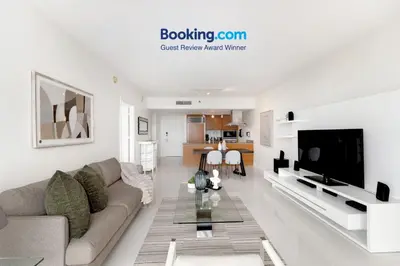a living room with a couch and a tv at ICON W BRICKELL BY IMD MIAMI Elegant River View 1BR 1BA in Miami