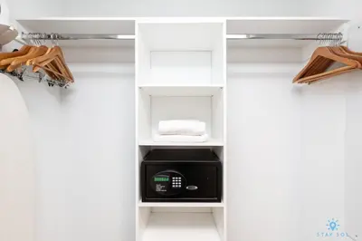 a closet with white shelves and a microwave in it at Amazing view - Balcony - Gym - Pool in Hallandale Beach