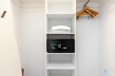 a walk in closet with a microwave and towels at Amazing view - Balcony - Gym - Pool in Hallandale Beach