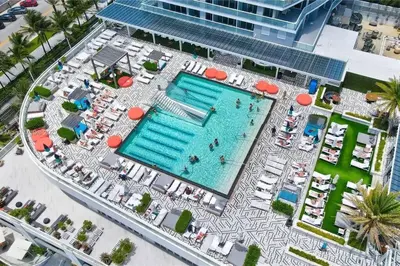 an overhead view of a pool at a resort at W FT LAUDERDALE RESIDENCES BY IMD MIAMI Stunning 2BR/2BA Unit in Fort Lauderdale