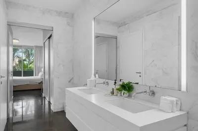 a white bathroom with a large sink and a mirror at BOULAN HOTEL MIAMI BEACH BY IMD MIAMI 1BR/1BA UNIT in Miami Beach