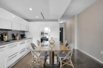 a dining room with a table and chairs in a kitchen at BOULAN HOTEL MIAMI BEACH BY IMD MIAMI 1BR/1BA UNIT in Miami Beach