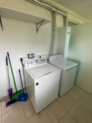 a laundry room with a washing machine and a washer at Stylish StudioBrickellLittle Havana-ItalianPlaza in Miami