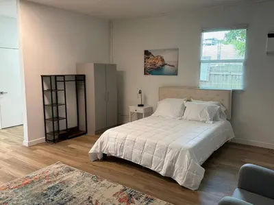 a bedroom with a white bed and a window at Stylish StudioBrickellLittle Havana-ItalianPlaza in Miami