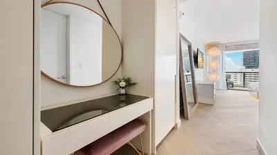 a bathroom with a sink and a mirror at 2B Ocean View Private Residence at South Beach - 804 in Miami Beach