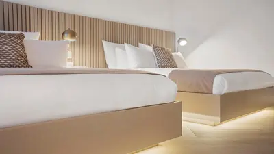 a bedroom with a large bed with white sheets and pillows at 2B Ocean View Private Residence at South Beach - 804 in Miami Beach