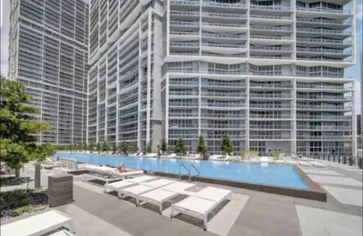 an architectural rendering of a large building with a pool at LOVELY 2 BR W ICON BRICKELL-WATERVIEWS -FREE SPA in Miami