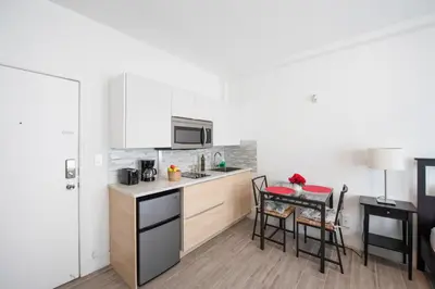 a kitchen with a table and chairs in a room at Lovely condo in Miami Beach in Miami Beach