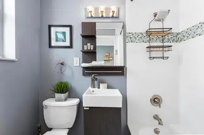 a bathroom with a white toilet and a sink at Lovely condo in Miami Beach in Miami Beach